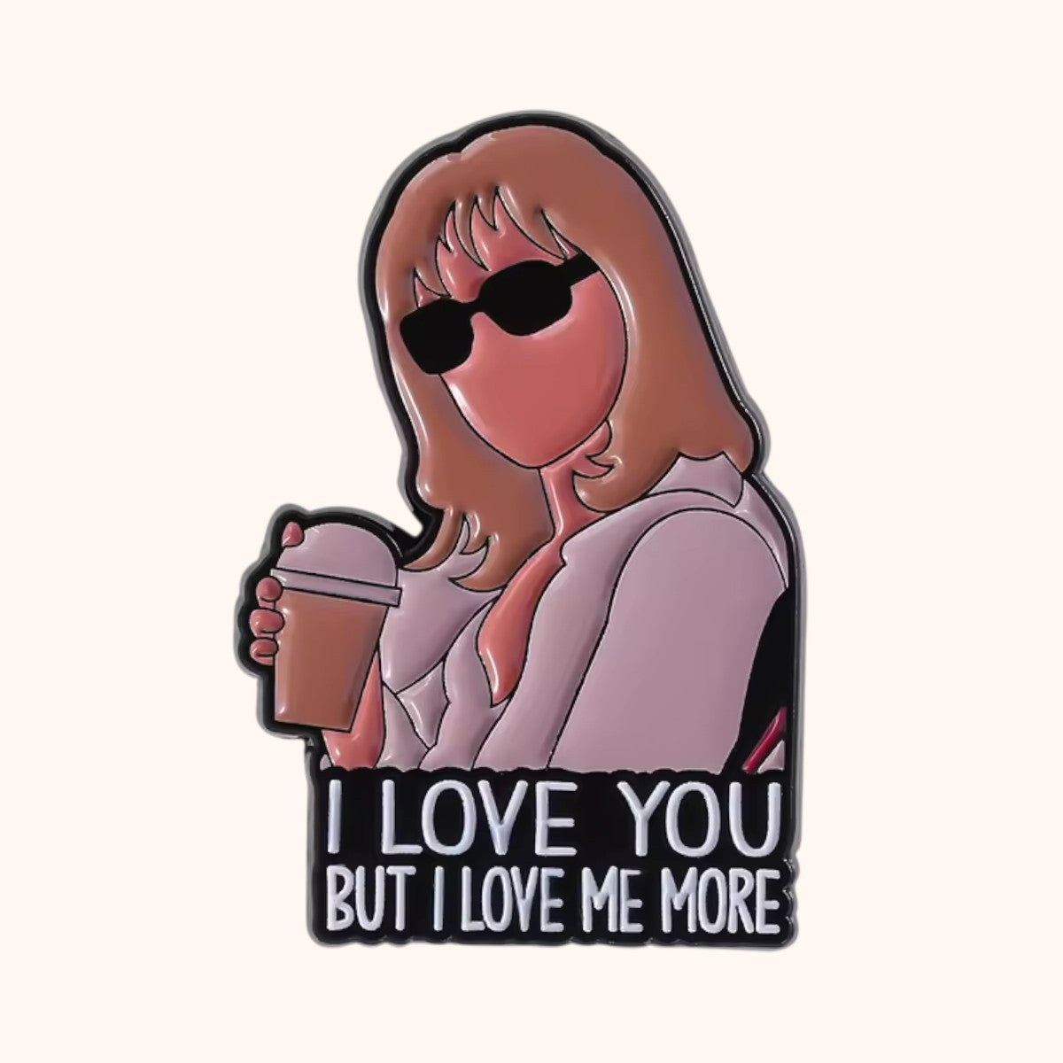 An enamel pin featuring an illustration of SATC-inspired Samantha Jones black sunglasses, and a pink blazer holding a coffee cup, with the text 'I LOVE YOU BUT I LOVE ME MORE' on a black background.