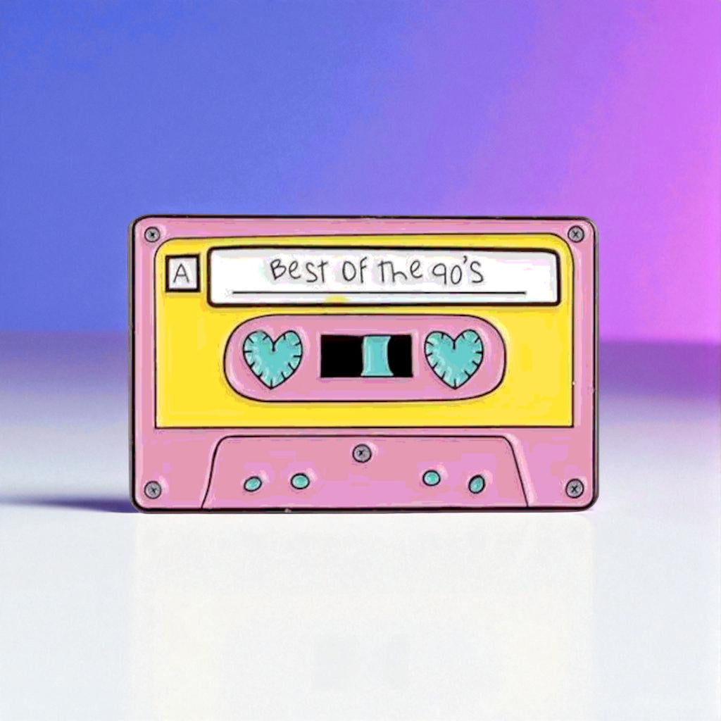 Pink cassette tape enamel pin with 'Best of the 90's' text on a gradient background