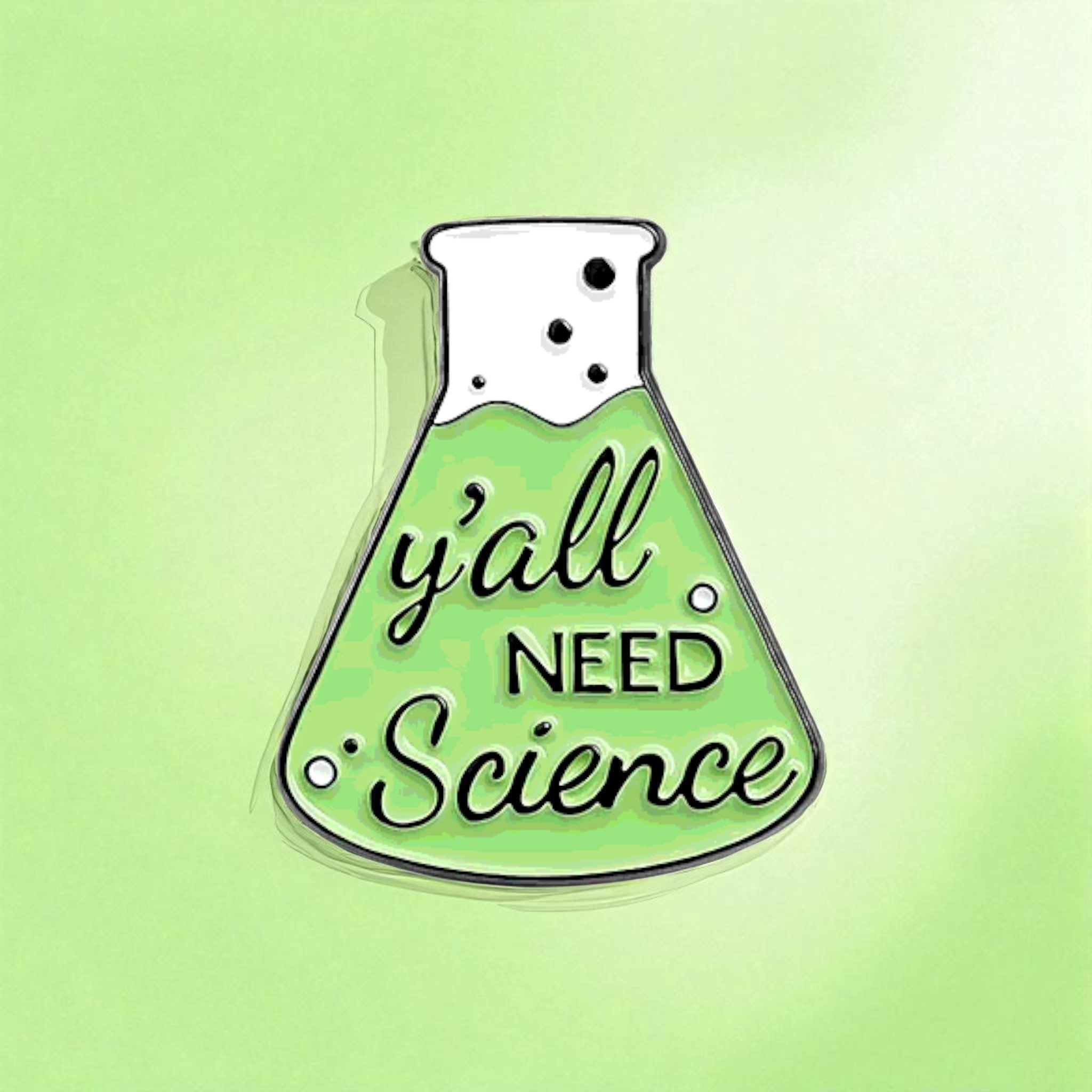 Enamel pin shaped like a beaker with 'y'all need science' text on a green background