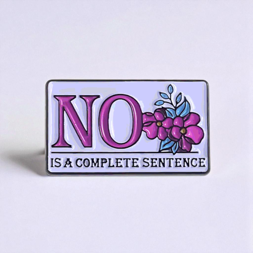 Enamel pin with 'NO is a complete sentence' text and floral design on a light purple background
