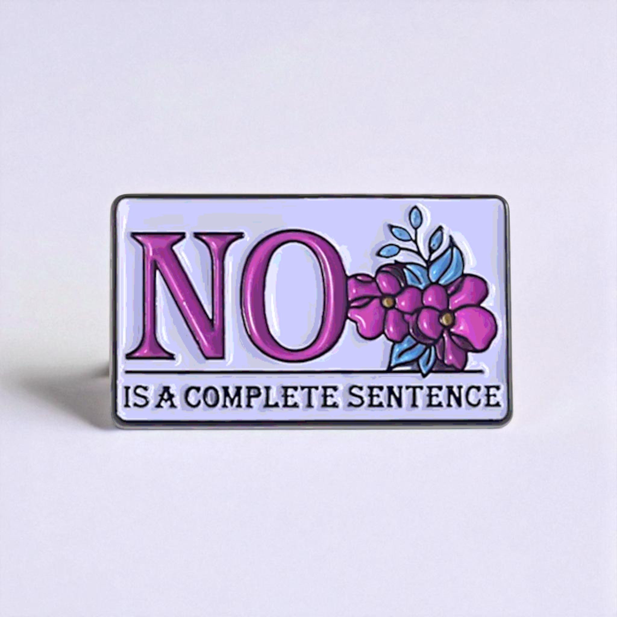 Enamel pin with 'NO is a complete sentence' text and floral design on a light purple background
