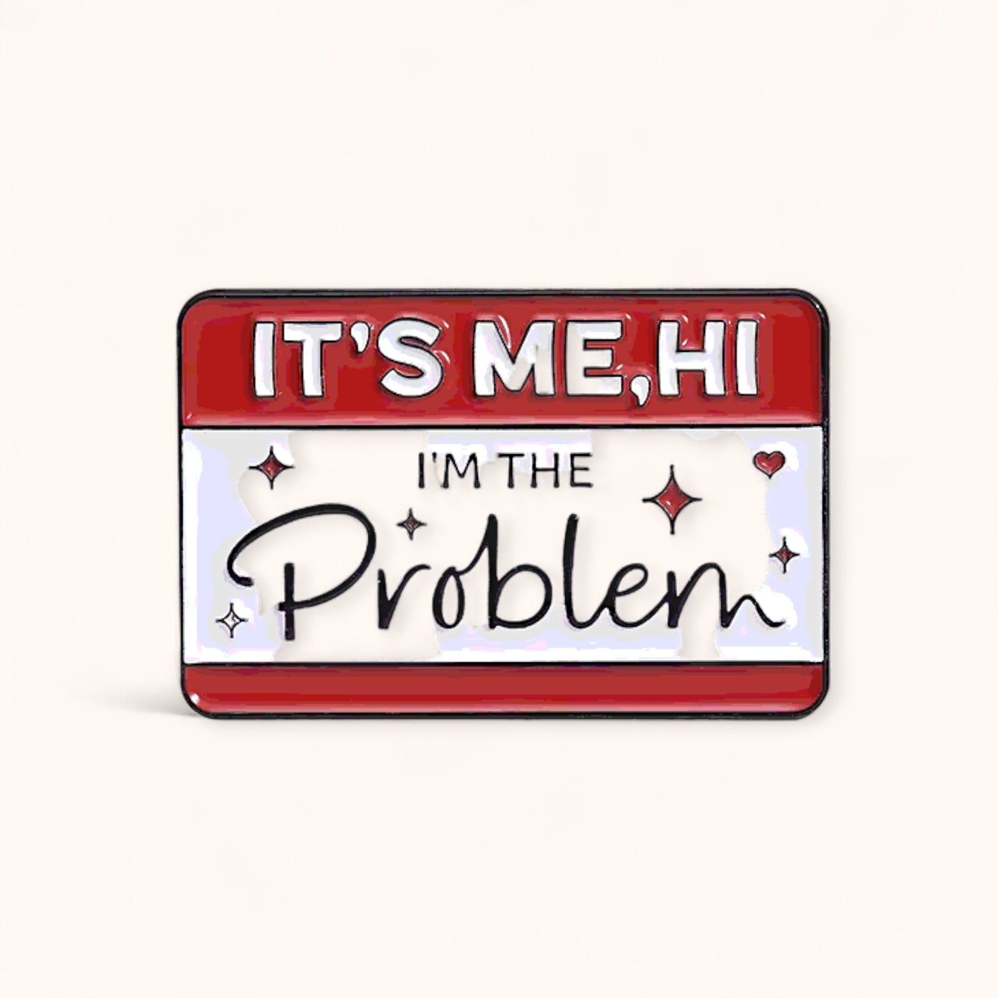 Enamel pin with text 'IT'S ME, HI I'M THE Problem' 