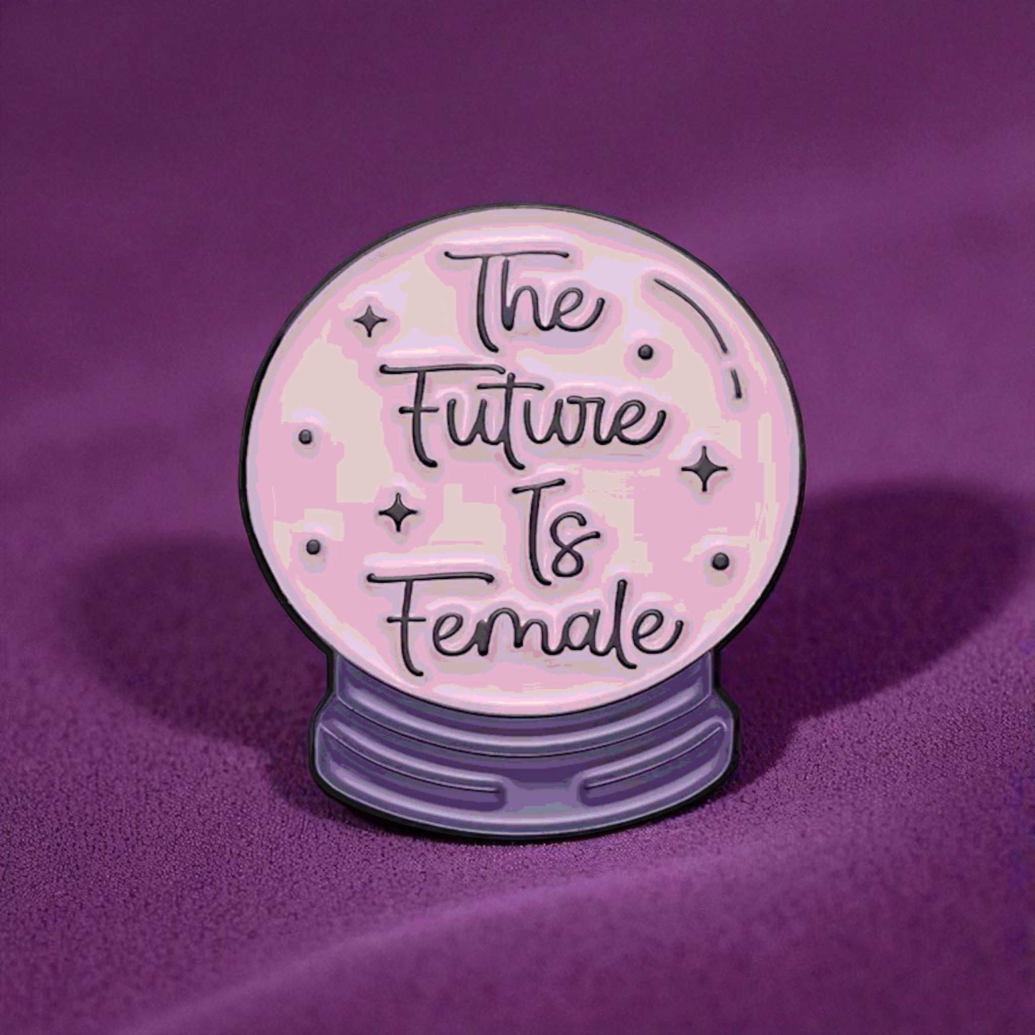 Decorative item with 'The Future Is Female' enamel pin