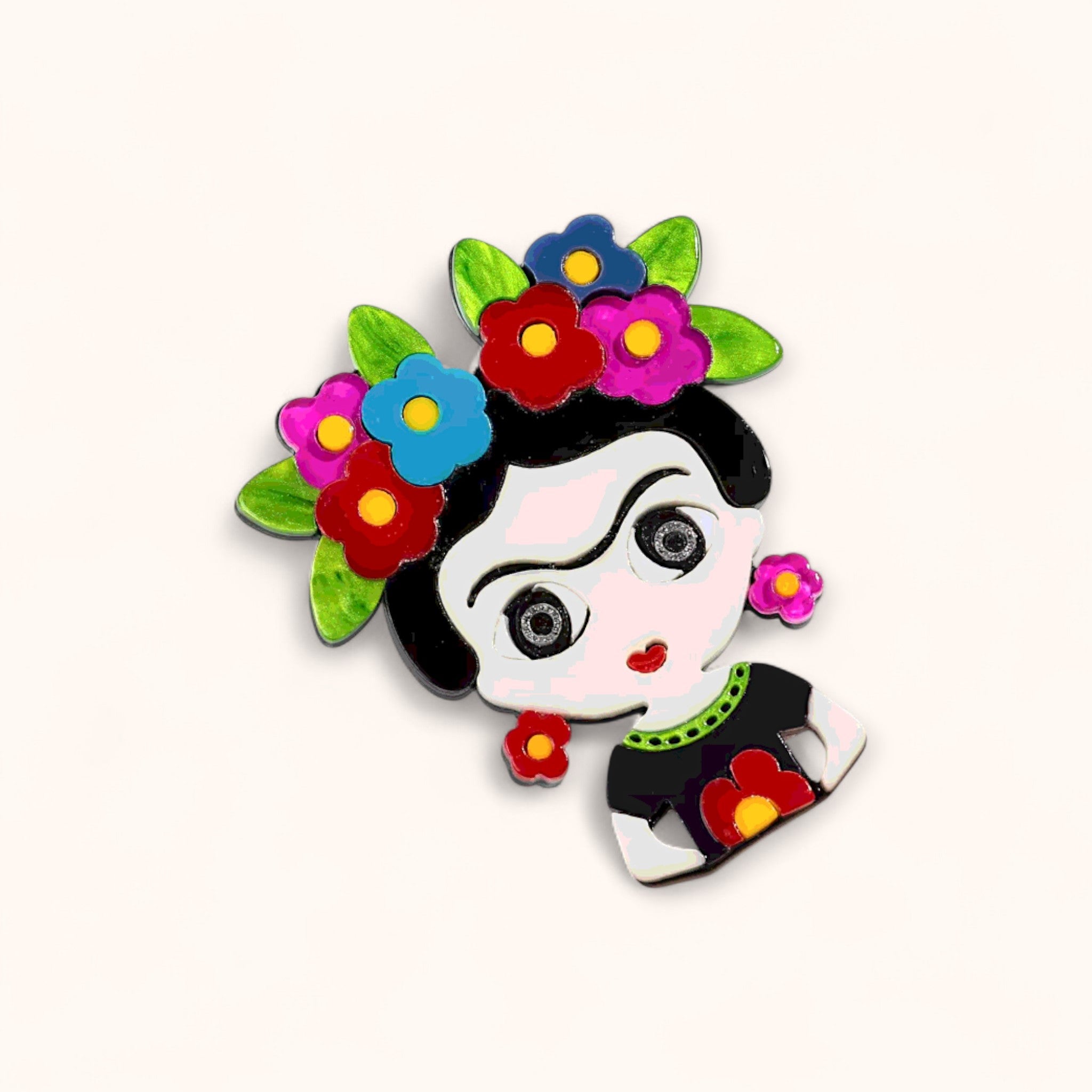 Colorful character with floral headpiece on an acrylic pin