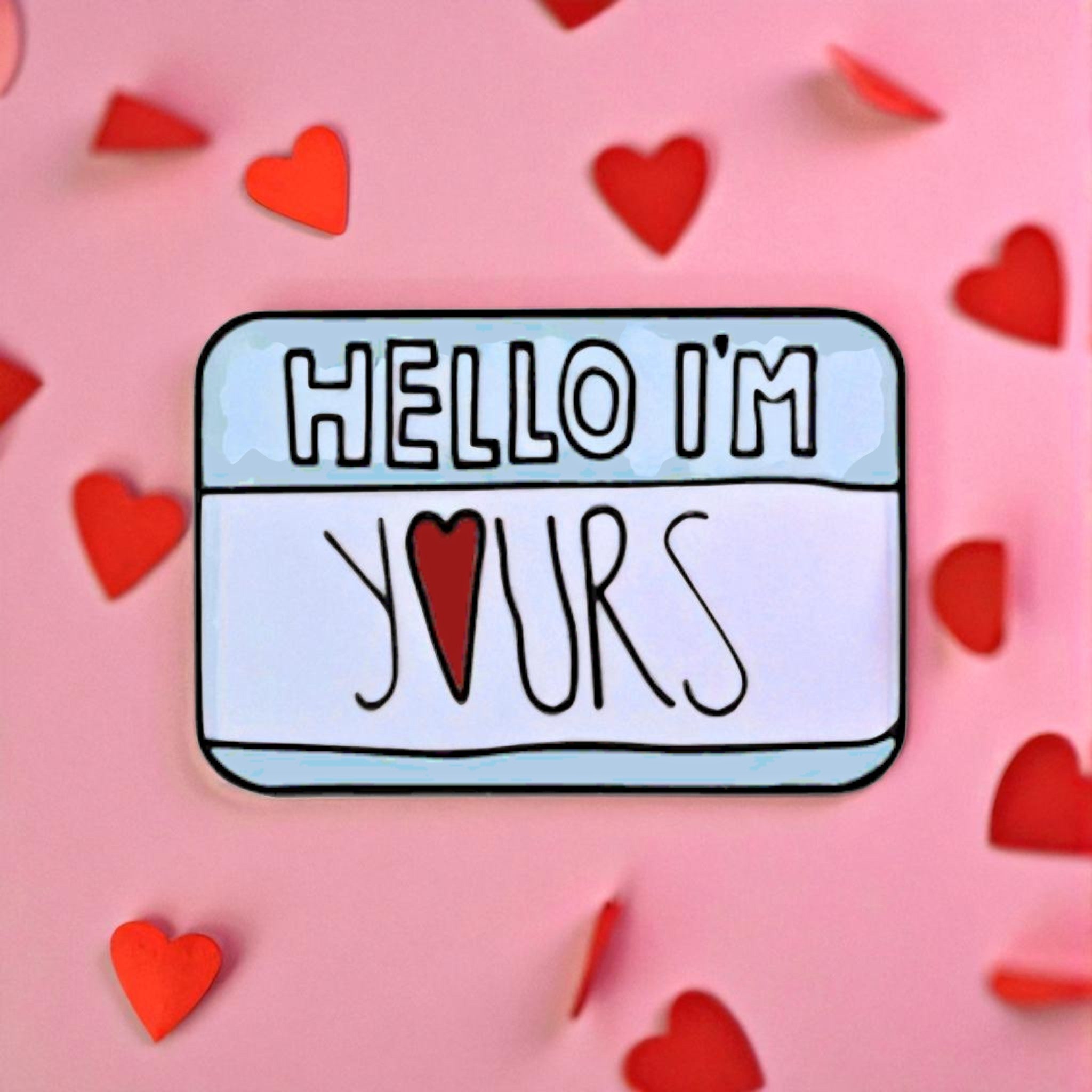 Name tag with 'HELLO I'M YOURS' enamel pin